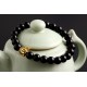 bracelet perles noires "bouddha doré"