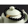 bracelet perles noires "bouddha doré"